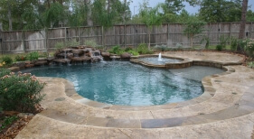 Natural Pool &amp; Spa with Rock Waterfall and Bubbler